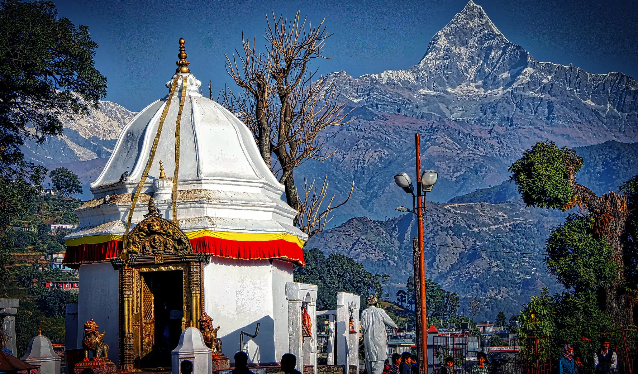 Bindhyabasini Temple in Pokhara with Machhapuchhre mountain rising in the background, showcasing Nepal’s spiritual heritage and Himalayan scenery.