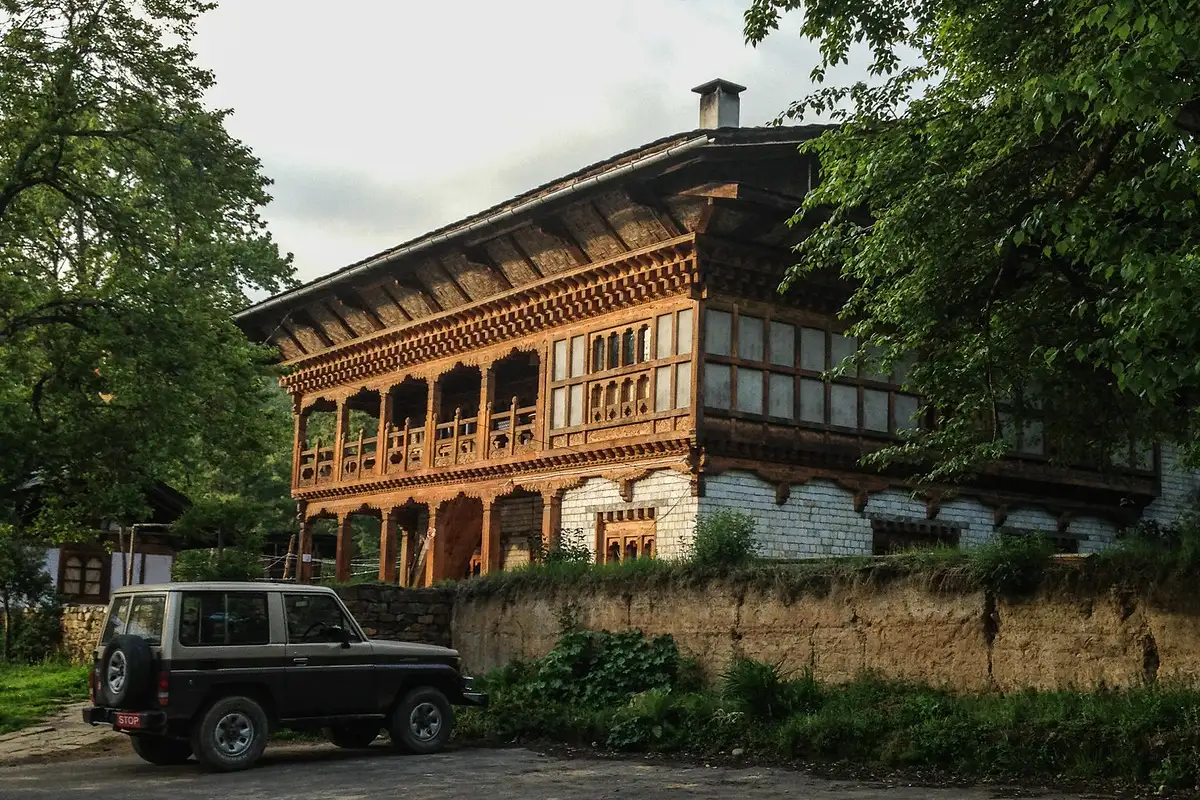 Bumthang Swiss Guest House exterior with traditional Bhutanese wooden architecture featured in a Bhutan accommodation guide.