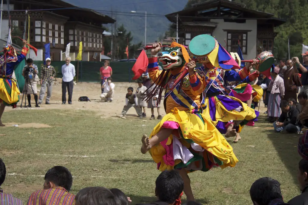 Masked dancer performs traditional drum dance at Haa Summer Festival in Bhutan.