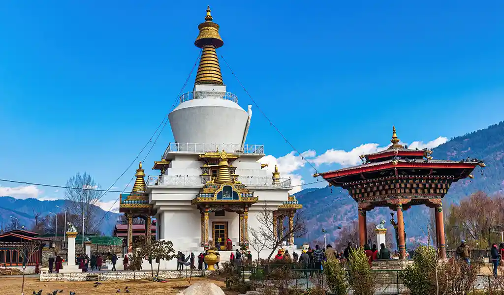 The National Memorial Chorten in Thimphu, a white stupa with golden spires that serves as a focal point for a Thimphu travel guide.