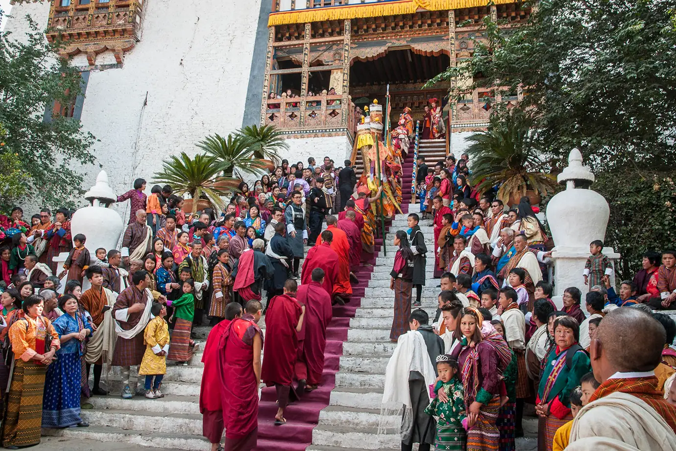 Monks and local people gather on the steps during Punakha Drubchen Festival in Bhutan.