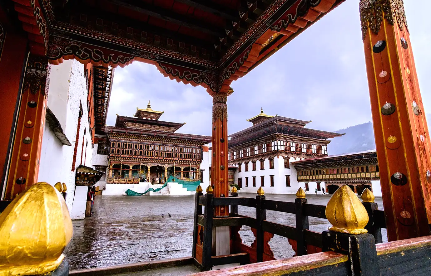 Interior courtyard view of Tashichho Dzong in Thimphu with traditional Bhutanese architecture, featured in Bhutan Travel Guide.