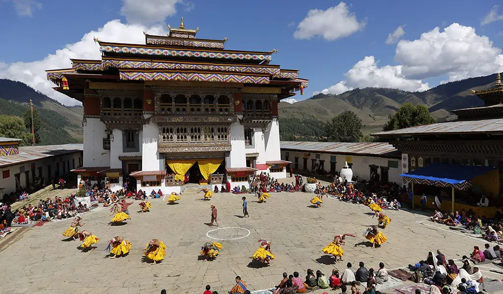 Traditional mask dance performance during Gangtey Tsechu festival at Gangtey Monastery in Phobjikha Valley Bhutan.