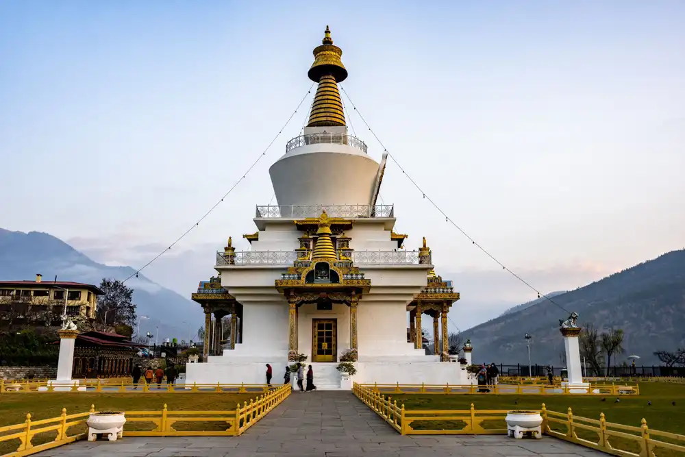 The ornate white Memorial Chorten in Thimphu under a clear blue sky, a centerpiece for any professional Bhutan photography tour.