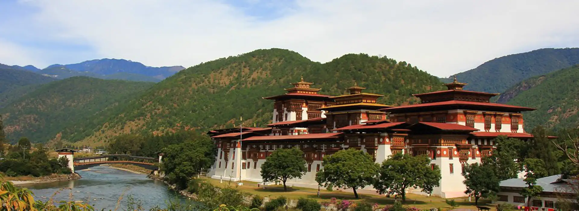 Punakha Dzong beside river under clear skies highlighting Bhutan's Weather in spring