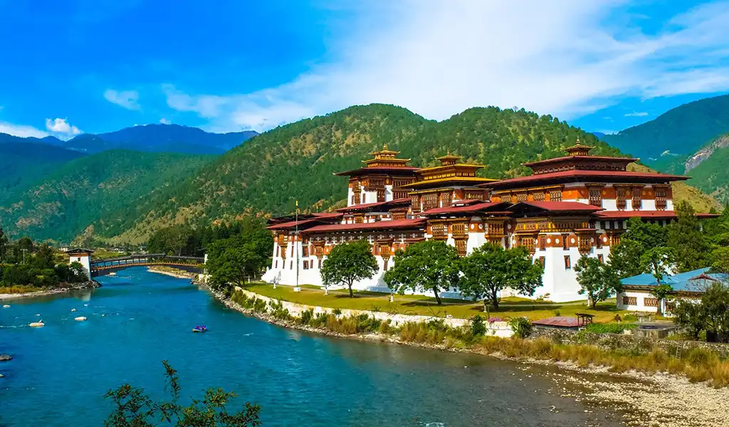 The majestic Punakha Dzong fortress at the confluence of two rivers, a romantic highlight of a Bhutan honeymoon tour.