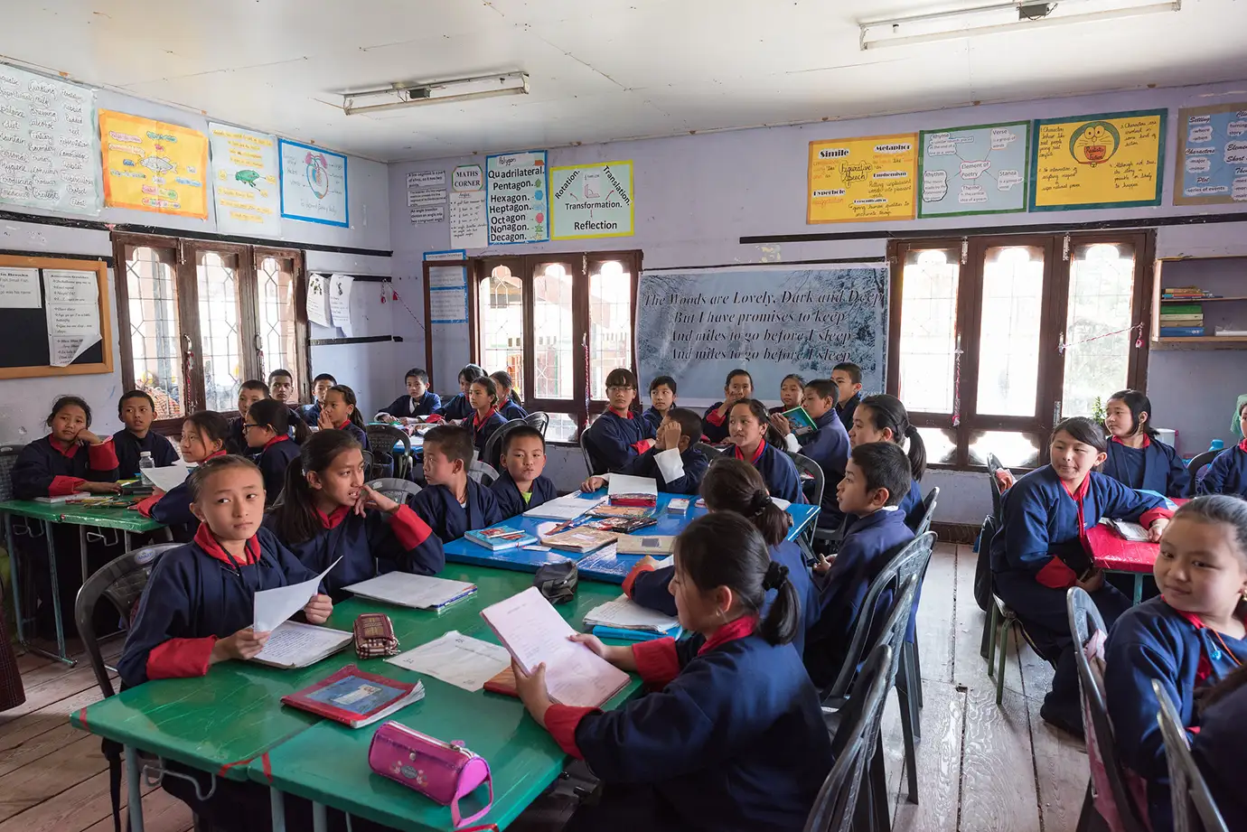 Students attending a classroom session in a traditional school environment in Bhutan.