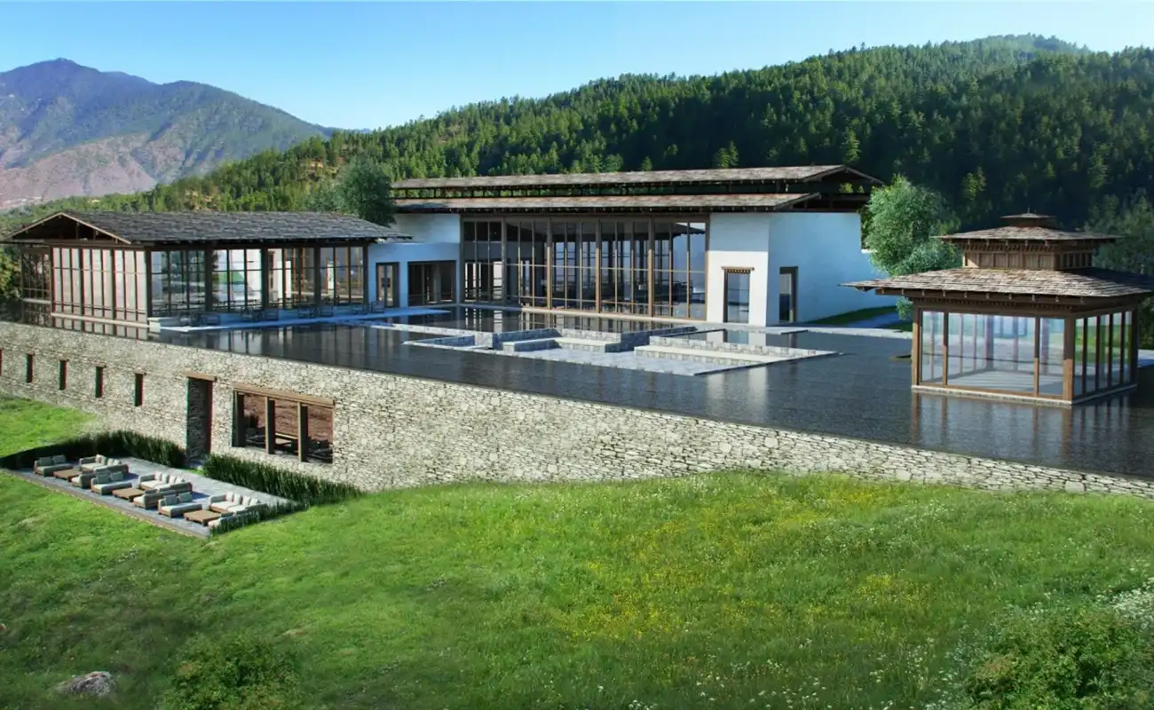 Luxury mountain resort in Bhutan with infinity pool and forested hills, a premium choice of a Bhutan accommodation guide.