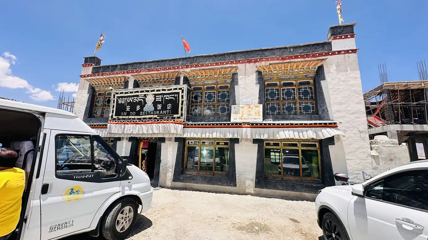 Traditional Tibetan guesthouse and restaurant building used by travelers during a Tibet Tour from Singapore.
