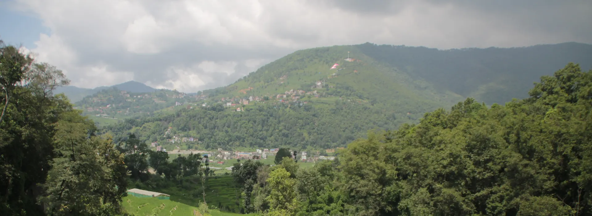 Lush green hills and terraced rice paddies surround the traditional village of Bungamati. This peaceful rural landscape is among the top Nepal bucket list destinations.