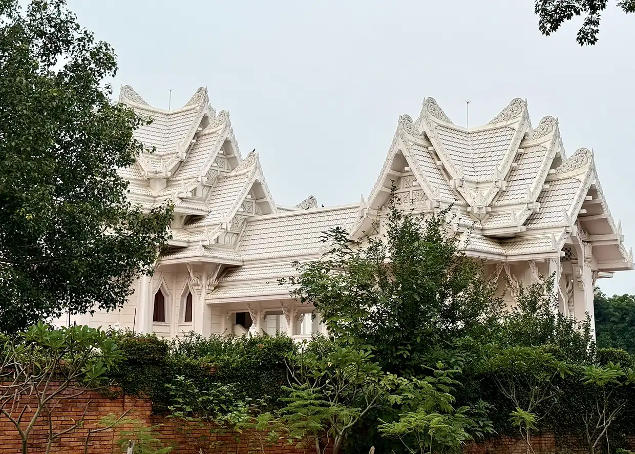 The Royal Thai Monastery features stunning white marble architecture and traditional tiered roofs. It is one of the best places to visit in Lumbini for cultural fans.