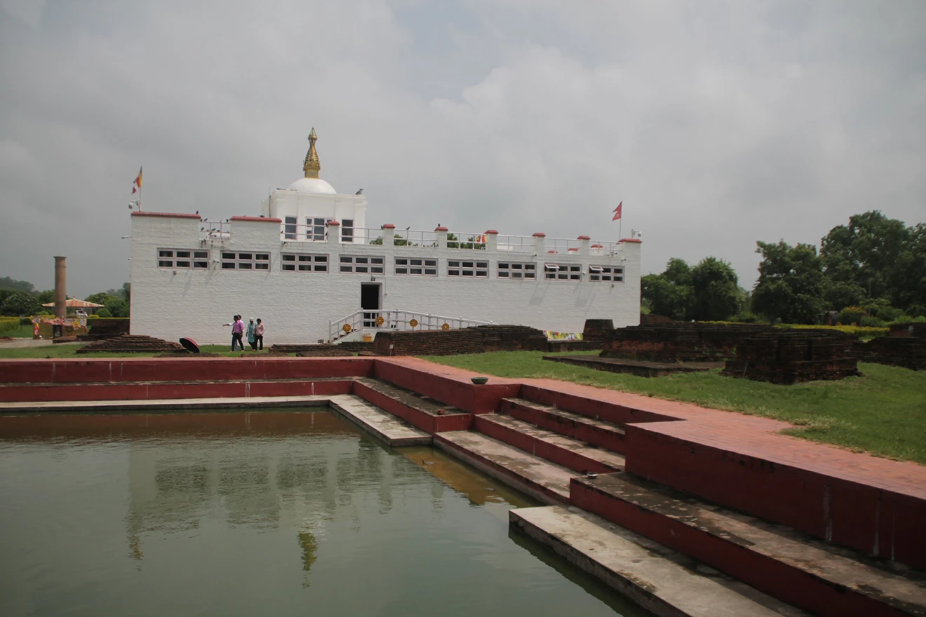 The serene Maya Devi Temple in Lumbini surrounded by lush green trees, a key location for the best short trips in Nepal for spiritual exploration.