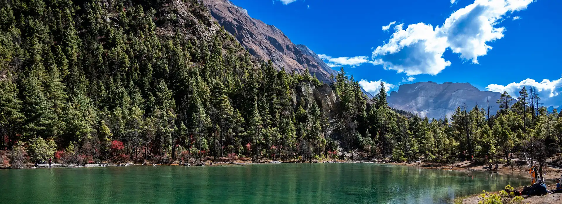 The stunning tranquil turquoise water of Dhumba Lake is nestled below forested slopes. Confirming the latest Nepal entry requirements for tourists allows for seamless exploration of this remote Manang beauty.