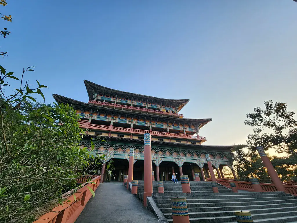 The large Korean Buddhist Temple in Lumbini features multi-tiered roofs and intricate colorful details, making it one of the best places to visit in Lumbini.