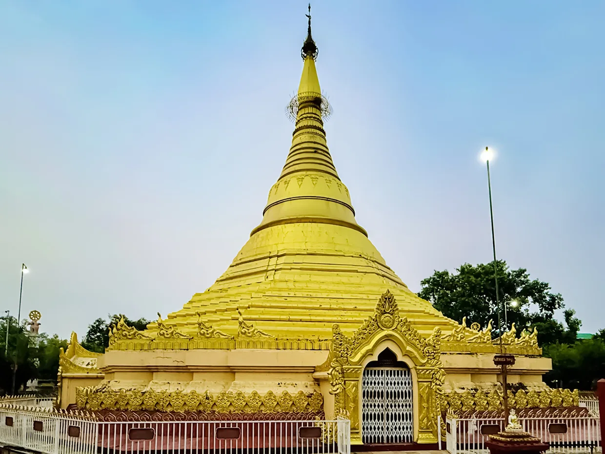 The Myanmar Golden Monastery features a towering gold stupa with intricate carvings. This breathtaking site is a must-see in any Lumbini Travel Guide.