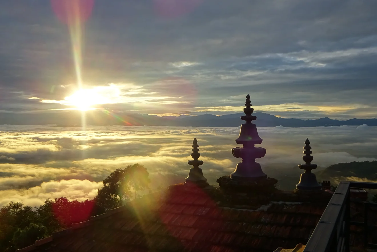The sun rises over a thick sea of clouds in Nagarkot, offering a stunning view often enjoyed during the best short trips in Nepal.