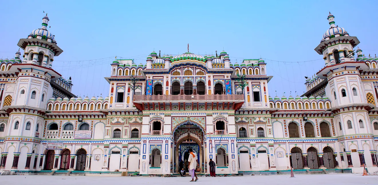 The ornate Janaki Temple in Janakpur displays colorful Rajput architecture and intricate details, marking it as a highlight among the best cities to visit in Nepal.