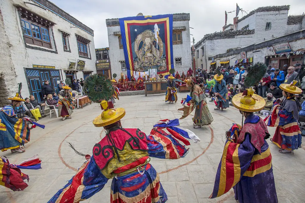 Monks perform a masked dance in Lo Manthang during the Tiji Festival. Knowing current Nepal Trekking Regulations is vital for travelers visiting this restricted region. 